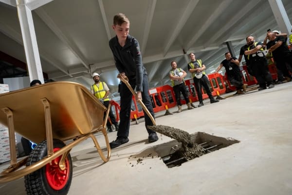 One of the Equinix team members helping finish the last pour of concrete.