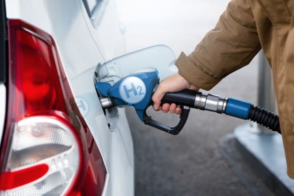 Hydrogen pump fueling a car at petrol station